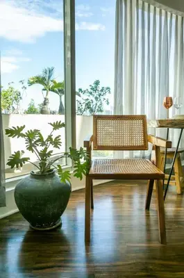 a room with a bench and a vase with a plant at Glass House w Stunning View in Poblacion Makati in Manila