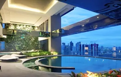 a large swimming pool in a building with a city skyline at C-Studio,Best Sunset Pool,Luxury,Hotel Style in Manila