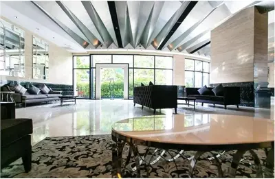 a living room with a table and chairs and windows at C-Studio,Best Sunset Pool,Luxury,Hotel Style in Manila