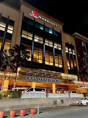 a grand ballroom with a car parked in front of it at 5min Staycation Away from Naia Terminal 3 Airport in Manila