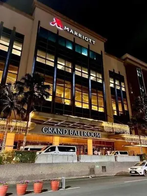 a grand ballroom with a car parked in front of it at Studio Unit Across NAIA T3 Airport MNL in Manila