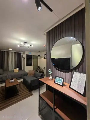 a living room with a large mirror on a wall at MetacasaStaycations-beside EK with Fireworks view in Santa Rosa