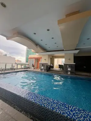 a large swimming pool on top of a building at JFS Home at Birch Tower in Manila