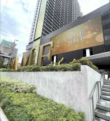 a sign for a fancy mall in front of a building at Fame Residences One-Bedroom Condo Unit in Manila