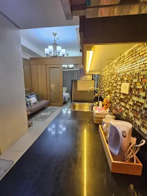 a bathroom with a sink and a toilet in a room at MOA Shell Residences Spacious 1BR with City View WiFi and Netflix in Manila