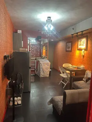 a living room with a couch and a dining room at Vintage Luxx-Solemare Parksuites Free Pool Access! in Manila