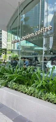 a building with a sign that reads northern broken coffee at Explore Mitsukoshi Uptown BGC, large TV, fast WIFI in Manila