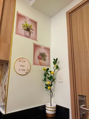 a room with three pictures of plants on the wall at Shore 2 Residences Tower 3 by HappyHaven in Manila