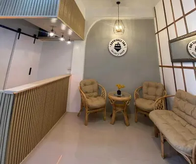 a waiting room with chairs and a table at OYO 1155 Carnivale Inn in Manila