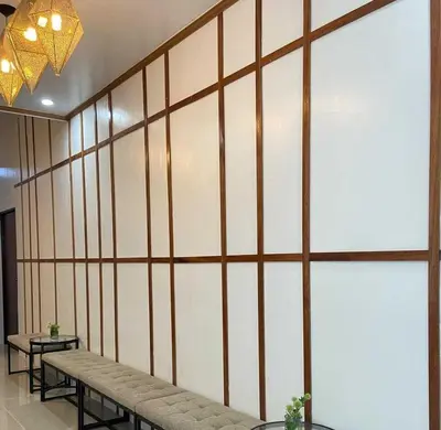 a large wall with benches in a room at OYO 1155 Carnivale Inn in Manila