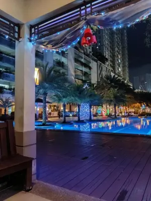 a view of a pool at night at Condo in Pasay 12th flr studio unit-near MOA, PICC in Manila
