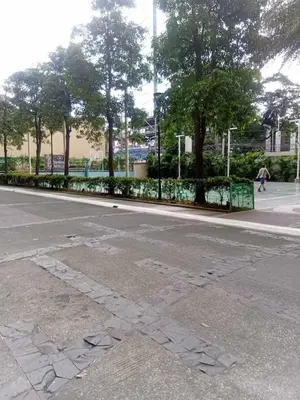 an empty street with a writing on the road at Condo in Pasay 12th flr studio unit-near MOA, PICC in Manila