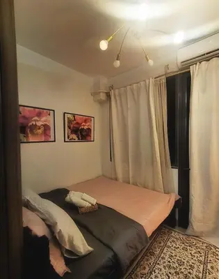 a bedroom with a bed and a window at Cozy 19 at Shore 2 Residences in Manila