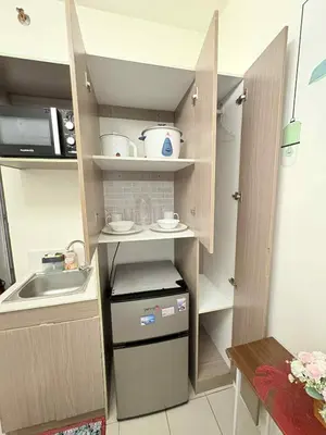 a small kitchen with a sink and a counter at JJMC PLACE 29 With Netflix and Unli Wifi in Manila