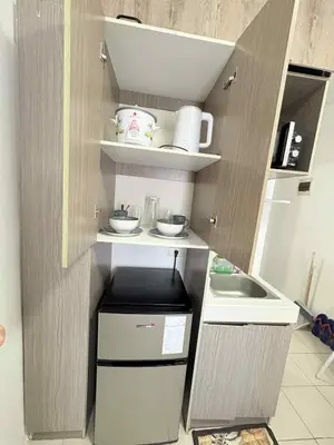 a small kitchen with a counter and a sink at JJMC PLACE 36 With Netflix and Unli Wifi in Manila