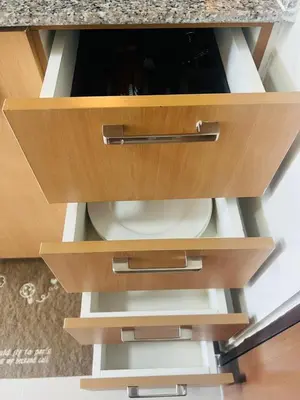 a wooden cabinet with a plate in it at Astra Heights Staycation in Manila