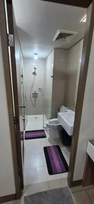 a bathroom with a sink and a toilet and a shower at Rooms in Pasay Manila Nearest To Airport Terminal 3 in Manila