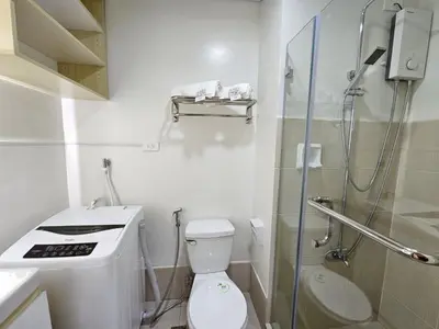 a small bathroom with a toilet and a shower at In My Jib Sucat in Manila