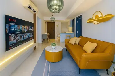 a living room with a couch and a table at Elegant and Modern 3BR Penthouse in Uptown BGC in Manila