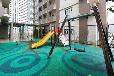 a playground in a building with a slide at FLAT ESHRA - Cozy Bright 1-BR in Manila