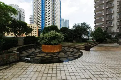 a park with a planter with a tree in it at FLAT ESHRA - Cozy Bright 1-BR in Manila