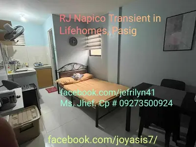 a small room with a bed and a kitchen at RJ Wallfan Studio Transient in Napico, Lifehomes Pasig City in Manila
