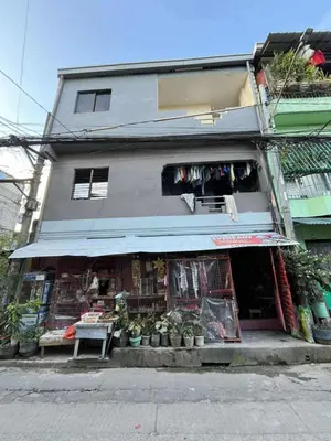 a store with plants in front of a building at RJ Wallfan Studio Transient in Napico, Lifehomes Pasig City in Manila