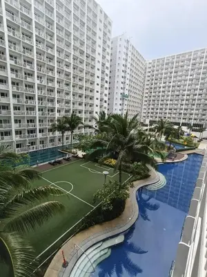 an aerial view of a large apartment complex with a pool at Shore residences Tower D pool view Unit in Manila