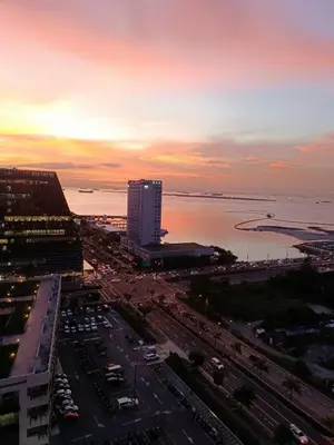 an aerial view of a city with the ocean at Cozy Coast Residences Pasay in Manila