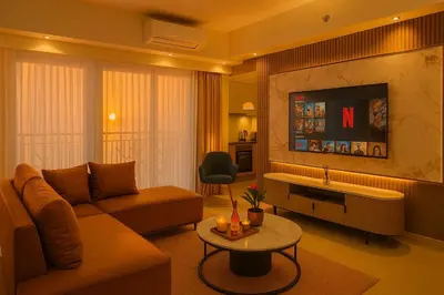 a living room with a couch and a table at Luxury 4 Bedroom Luxury Suite near Solaire & Okada in Manila