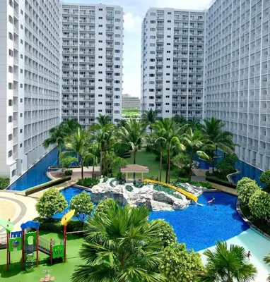 a view of a water park in a city at Staycation near MOA, Airport in Manila