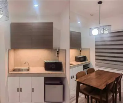 a kitchen with a wooden table and a sink at Las Enchanted kingdom Cozy Woody in Santa Rosa