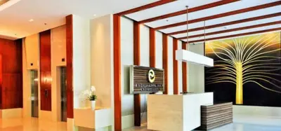 a lobby with a television and a painting on the wall at Newly Renovated 2-storey Loft at Greenbelt 1 Near Legaspi Park in Manila