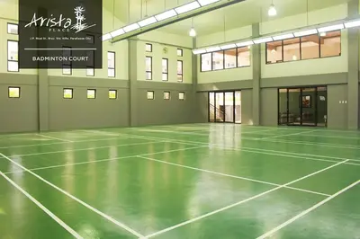 an empty gym with a tennis court in a building at Arista Place 2 bedroom Condo near airport in Manila