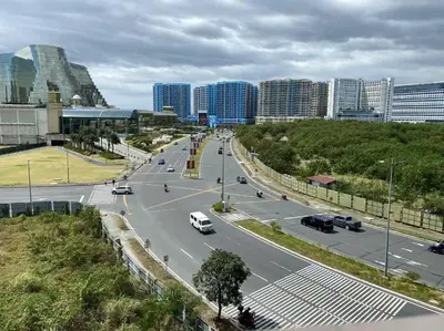 a city street with cars driving on a highway at Airport Home Base Trips Getaways 3pax balcony 6g in Manila