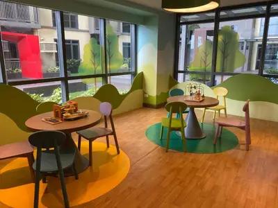two tables and chairs in a room with windows at Airport Home Base Trips Getaways 3pax balcony 6g in Manila