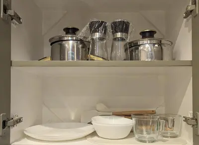 a shelf with pots and pans and bowls on it at BBricks Alabang Beside Festival Mall in Manila