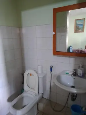 a bathroom with a toilet and a sink at One Oasis Ortigas H212 in Manila