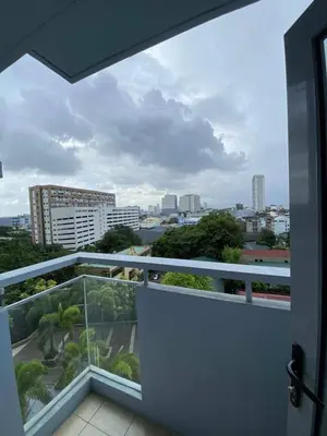 a balcony with a view of a city at Modern Spacious 2BR 68 sqm Condo in Manhattan Heights Pool View in Manila