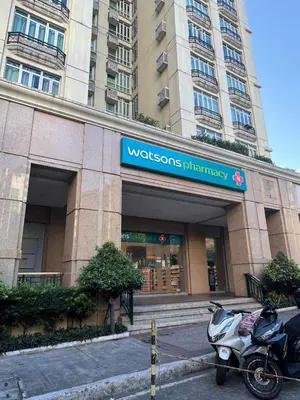 a motorcycle parked in front of a building at Affordable Condo Suite with WIFI in McKinley BGC in Manila