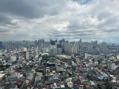 an overhead view of a large city with buildings at Modern 2BR Condo with Balcony in Central Manila in Manila