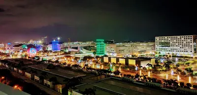 a city skyline at night with buildings and lights at Balay Maria at Shore in Manila