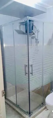 a shower stall with a sink and a toilet at 1Bedroom for rent Amaia Skies Shaw in Manila