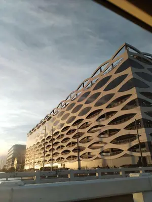a building with a geometric design on the side of it at Gentry Manor Seaview Family Suite balcony View WiFi Netflix 17S in Manila