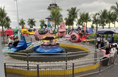 a water park with a roller coaster at Gentry Manor Seaview Family Suite balcony View WiFi Netflix 17S in Manila