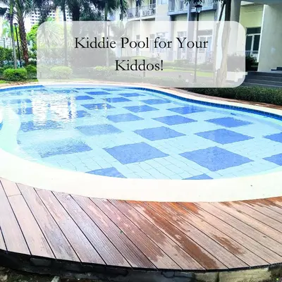 a pool for your backyard with a wooden deck at Casa Solana at SMDC South Residences in Manila