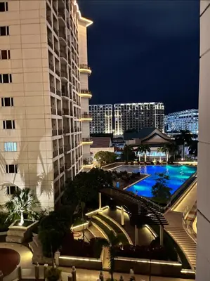 a view of a city at night from a building at Solemare parksuites in Manila