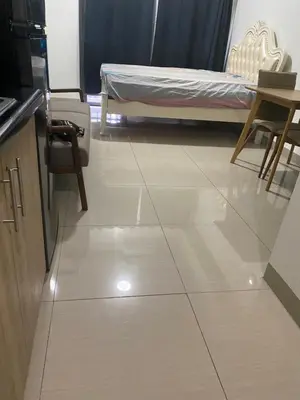 a room with a bed and a tiled floor at Shore 2 Tower 1 in Manila
