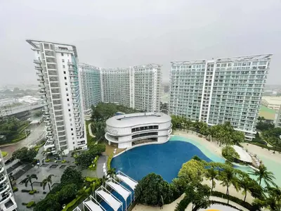 an aerial view of a building with a swimming pool at B&T Azure Staycation - Parañaque in Manila