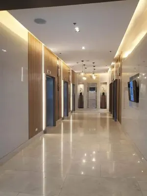 a hallway of a building with a hallwayngth at Shore 3 Residences Condo with Netflix and Wifi in Manila